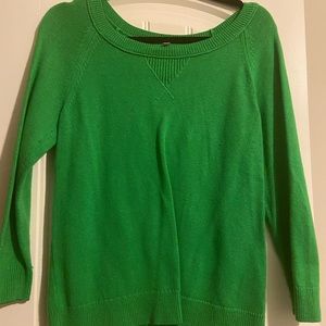 Green sweater.